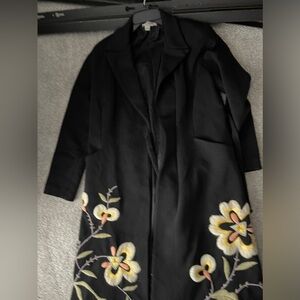 Long wool coat with embroidered accents in white and yellow by Kay Unger